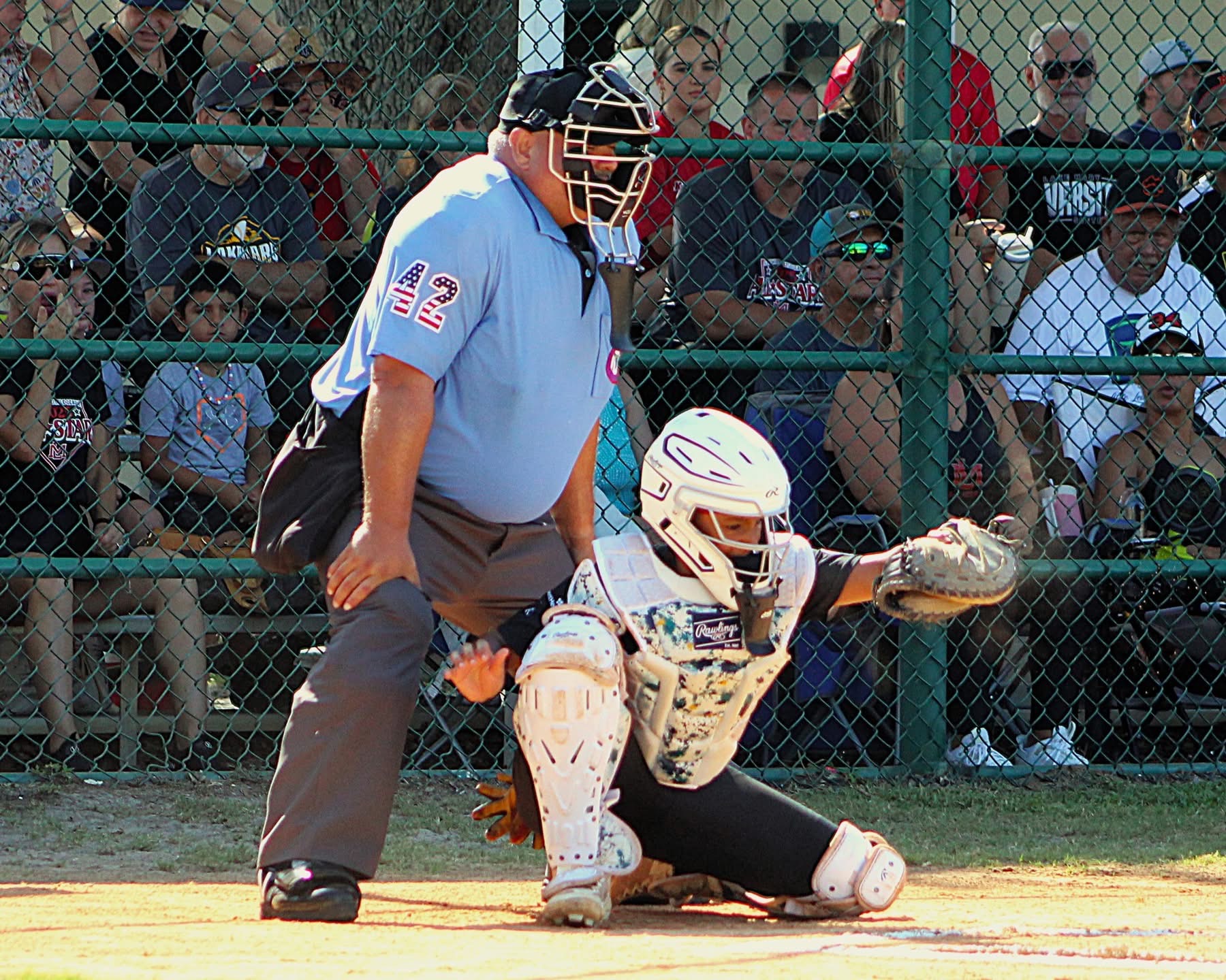 Man umpires behind home plate