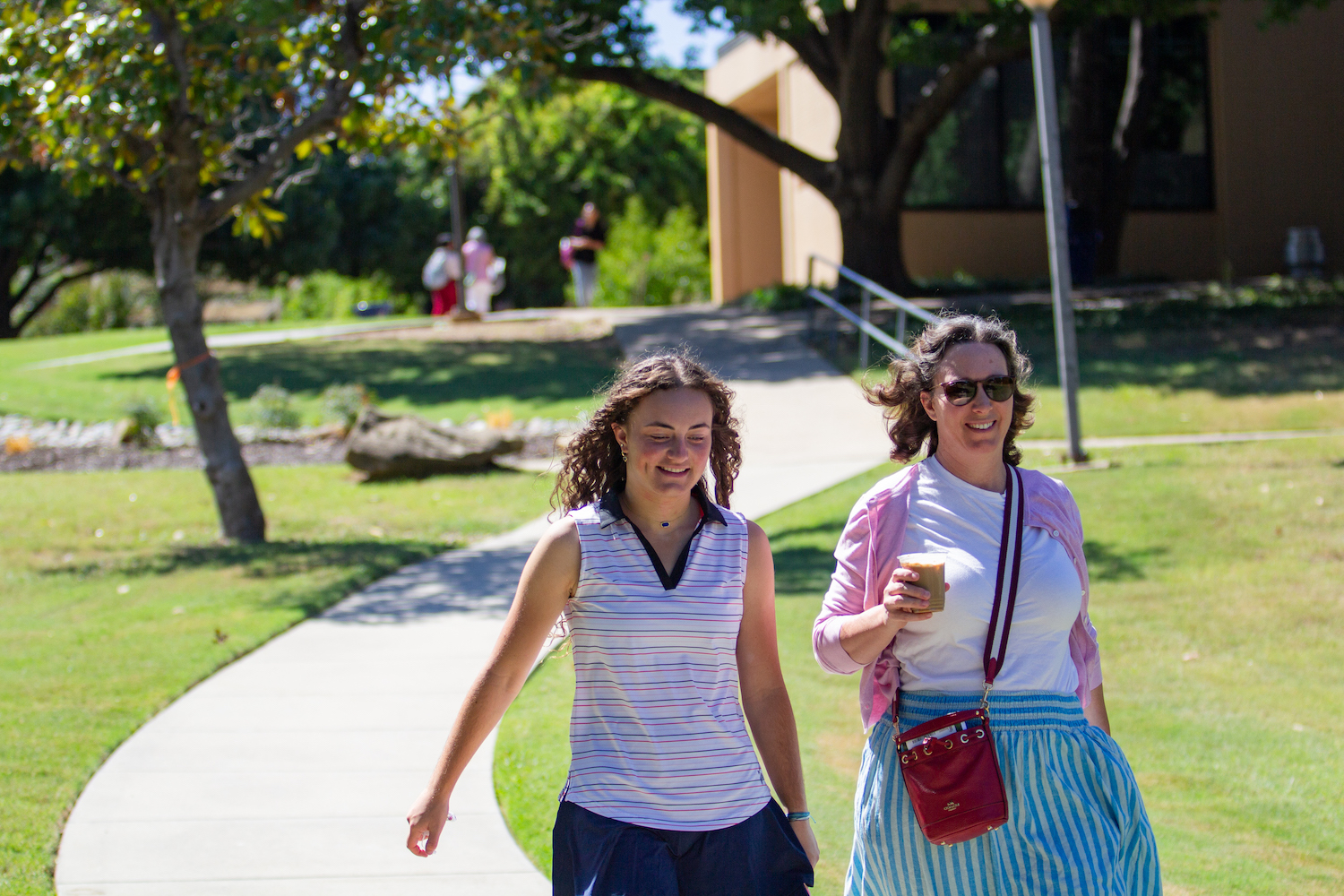 Mother and daughter walking away from Haggar University Center